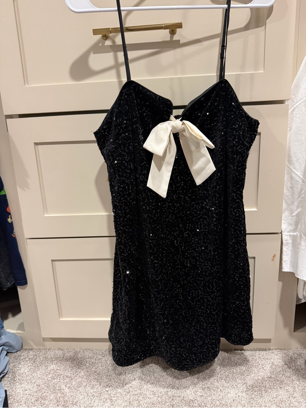 Divided Black Sequin Mini Dress with Ivory Bow Accent